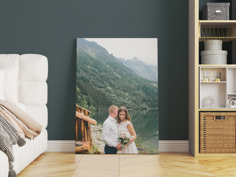 Custom wedding photo printing from Wall Nostalgia. Pictured is a custom canvas wedding photo as bedroom decor. Made in Calgary, Canada and are available for worldwide shipping. High-quality custom wedding photo printing and family photo printing in Canada